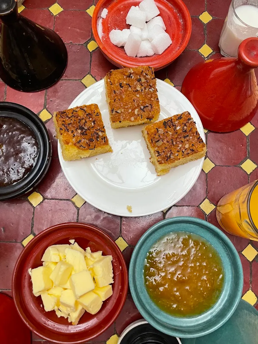 Msemen with honey on colourful plates