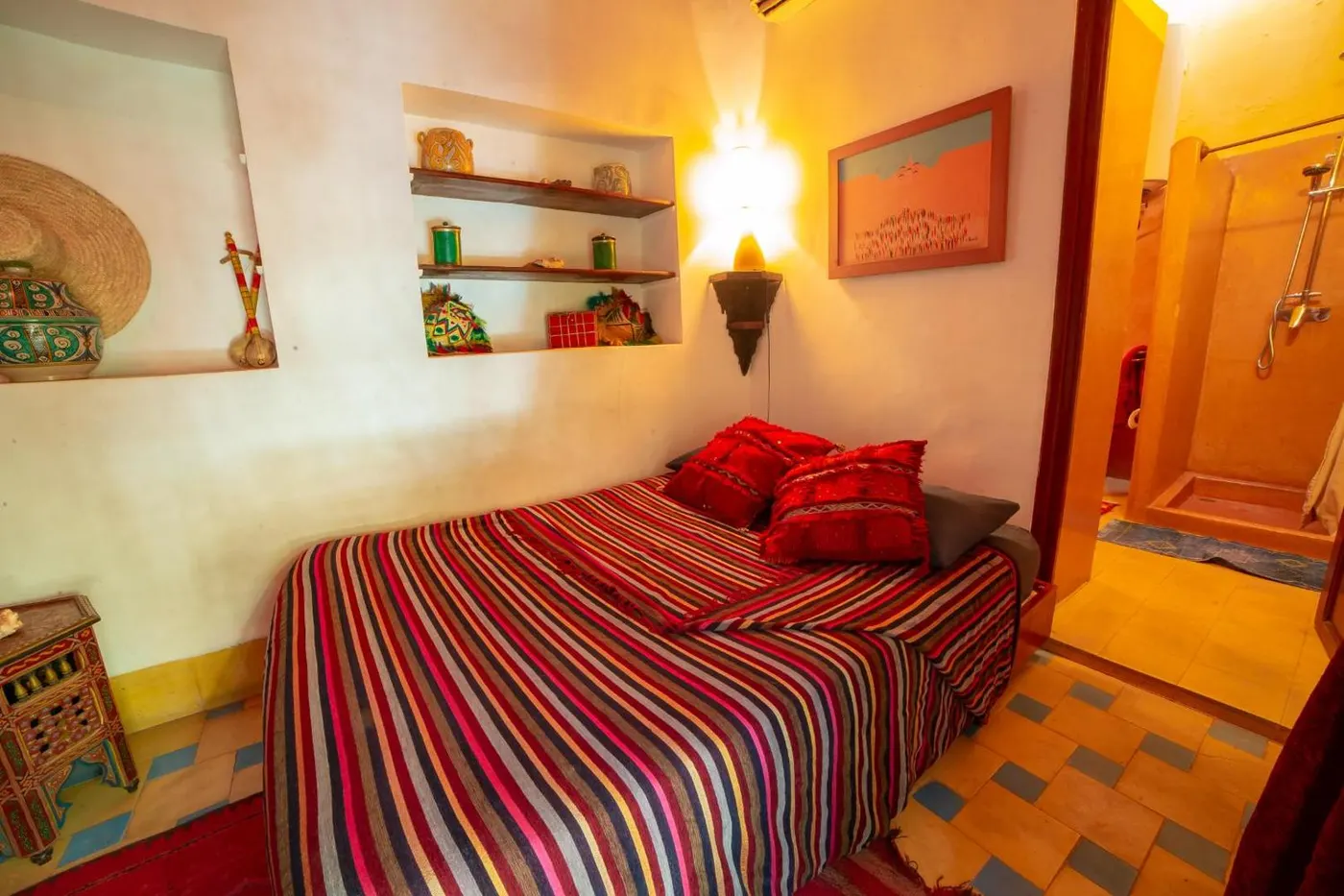 Bed dressed in a striped Berber blanket